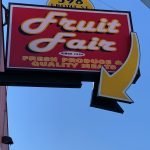 Sign for Fruit Fair market in Chicopee with retro arrow toward door