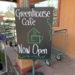 Sign that says Greenhouse Cafe is open