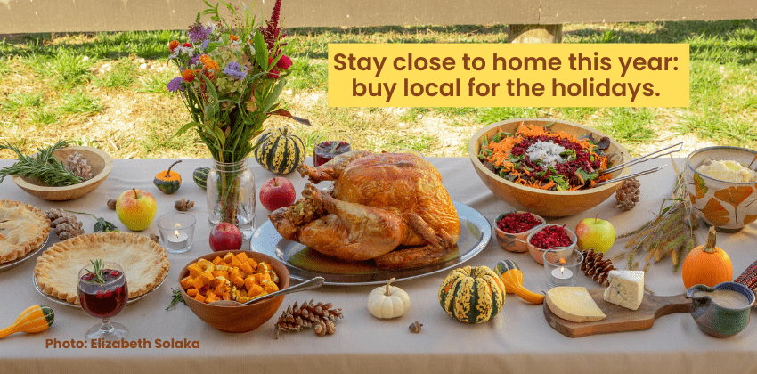 Thanksgiving table with turkey, vegetables, and pie